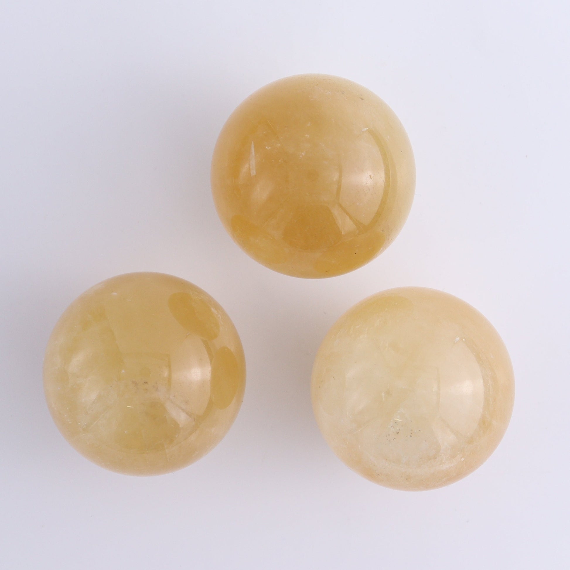 Calcite Spheres Set of 9 - Expert Wholesale and Supplier of Wholesale Crystals & Bulk Gemstones, ["Calcite","Mexico","Spheres"]