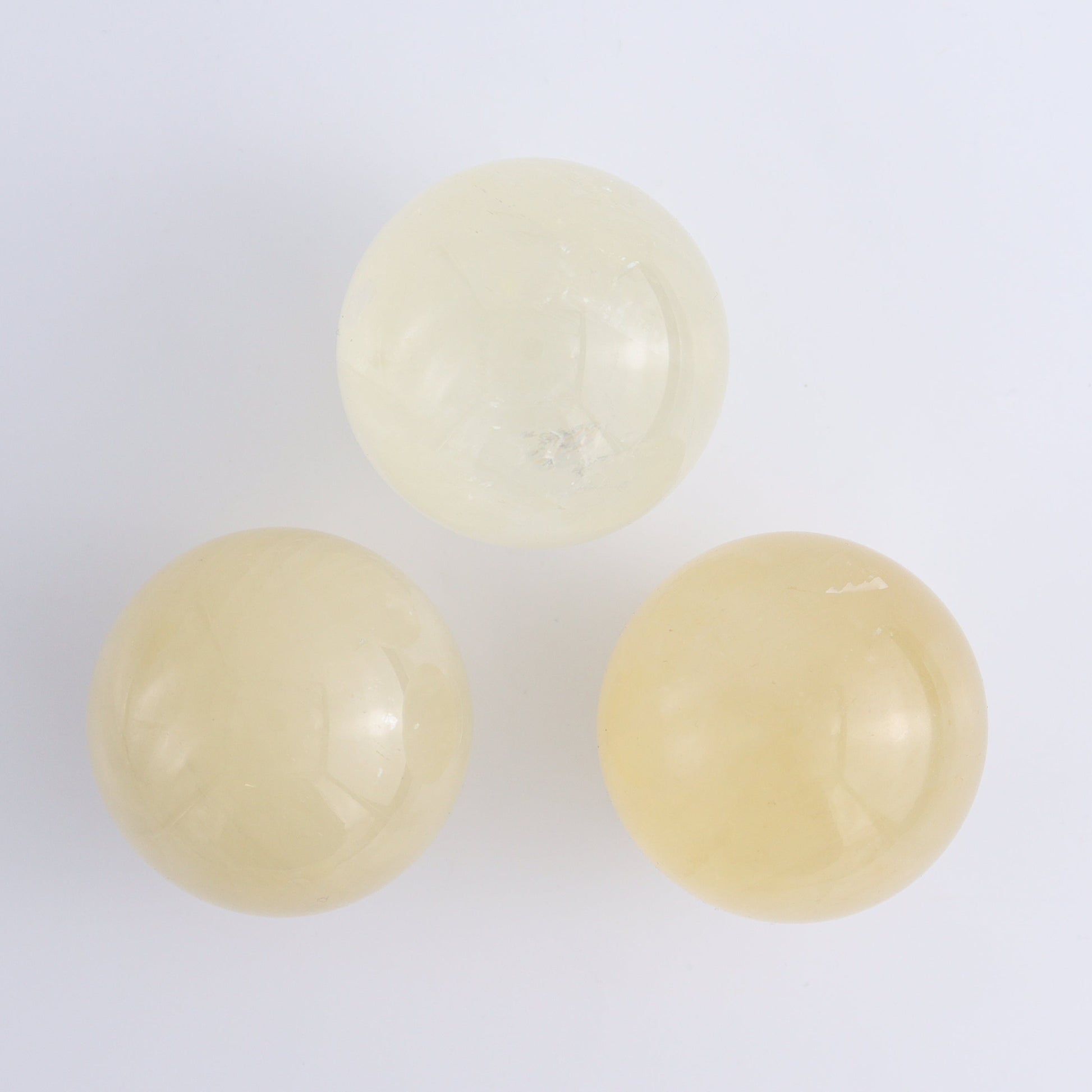 Calcite Spheres Set of 9 - Expert Wholesale and Supplier of Wholesale Crystals & Bulk Gemstones, ["Calcite","Mexico","Spheres"]