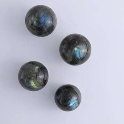 Labradorite Spheres Flat of 24 - Expert Wholesale and Supplier of Wholesale Crystals & Bulk Gemstones, ["Labradorite","Madagascar","Spheres"]