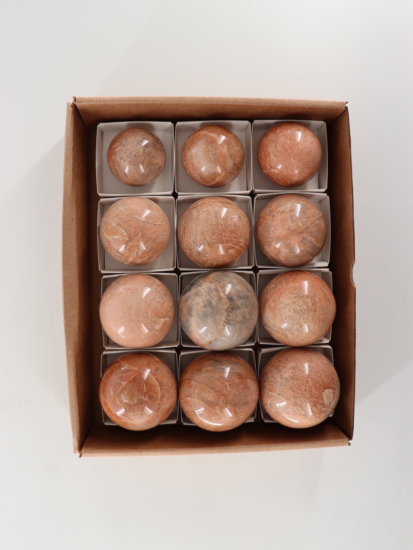 Peach Moonstone Spheres Set of 12 - Expert Wholesale and Supplier of Wholesale Crystals & Bulk Gemstones, []