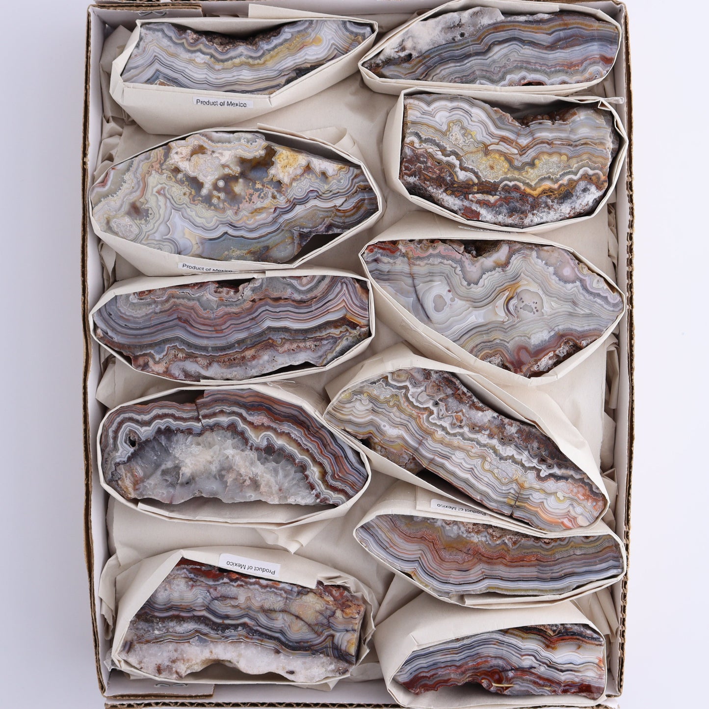 Crazy Lace Agate Flat of 11 - Expert Wholesale and Supplier of Wholesale Crystals & Bulk Gemstones, ["Crazy Lace Agate","Mexico"]