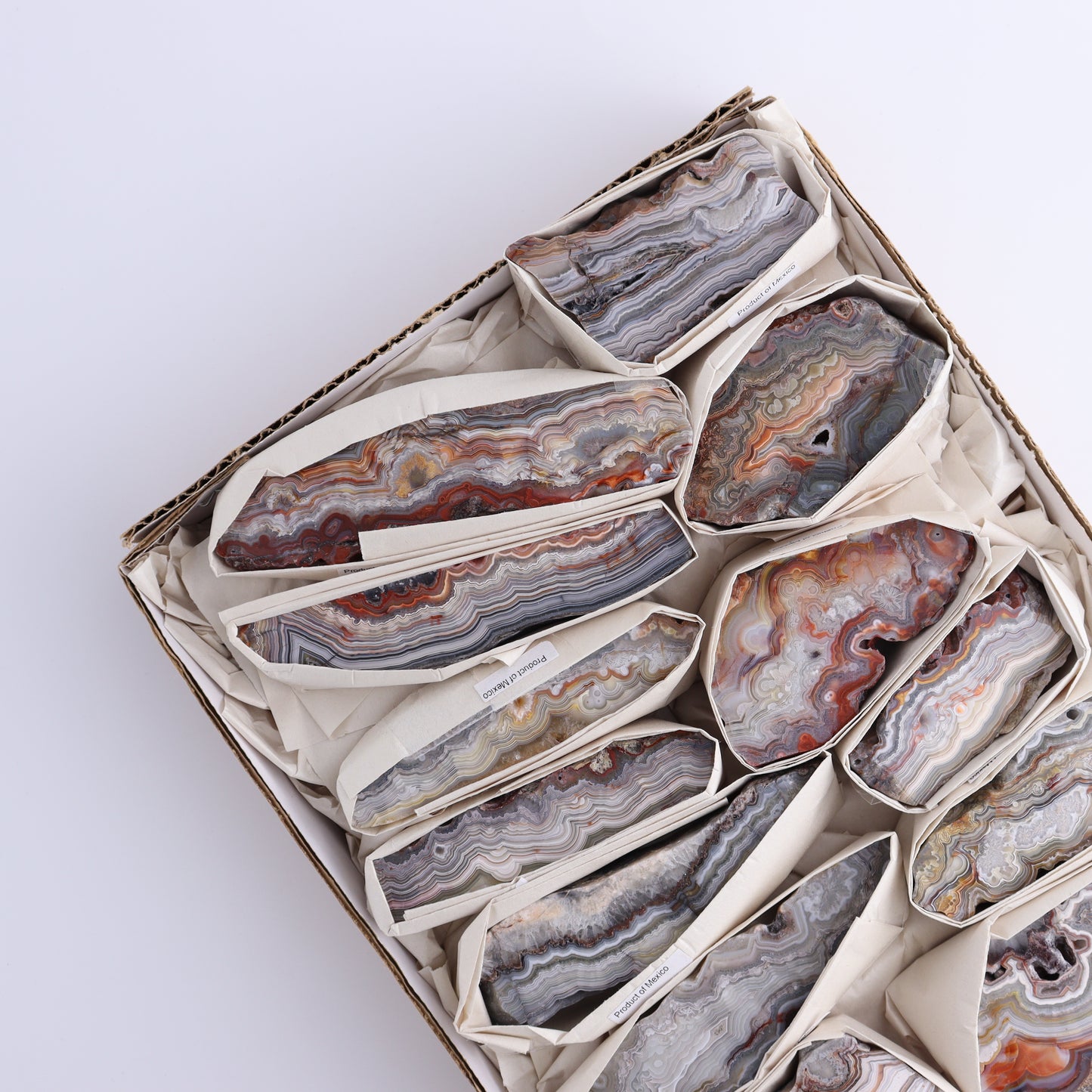 Crazy Lace Agate Flat of 13 - Expert Wholesale and Supplier of Wholesale Crystals & Bulk Gemstones, ["Crazy Lace Agate","Mexico"]