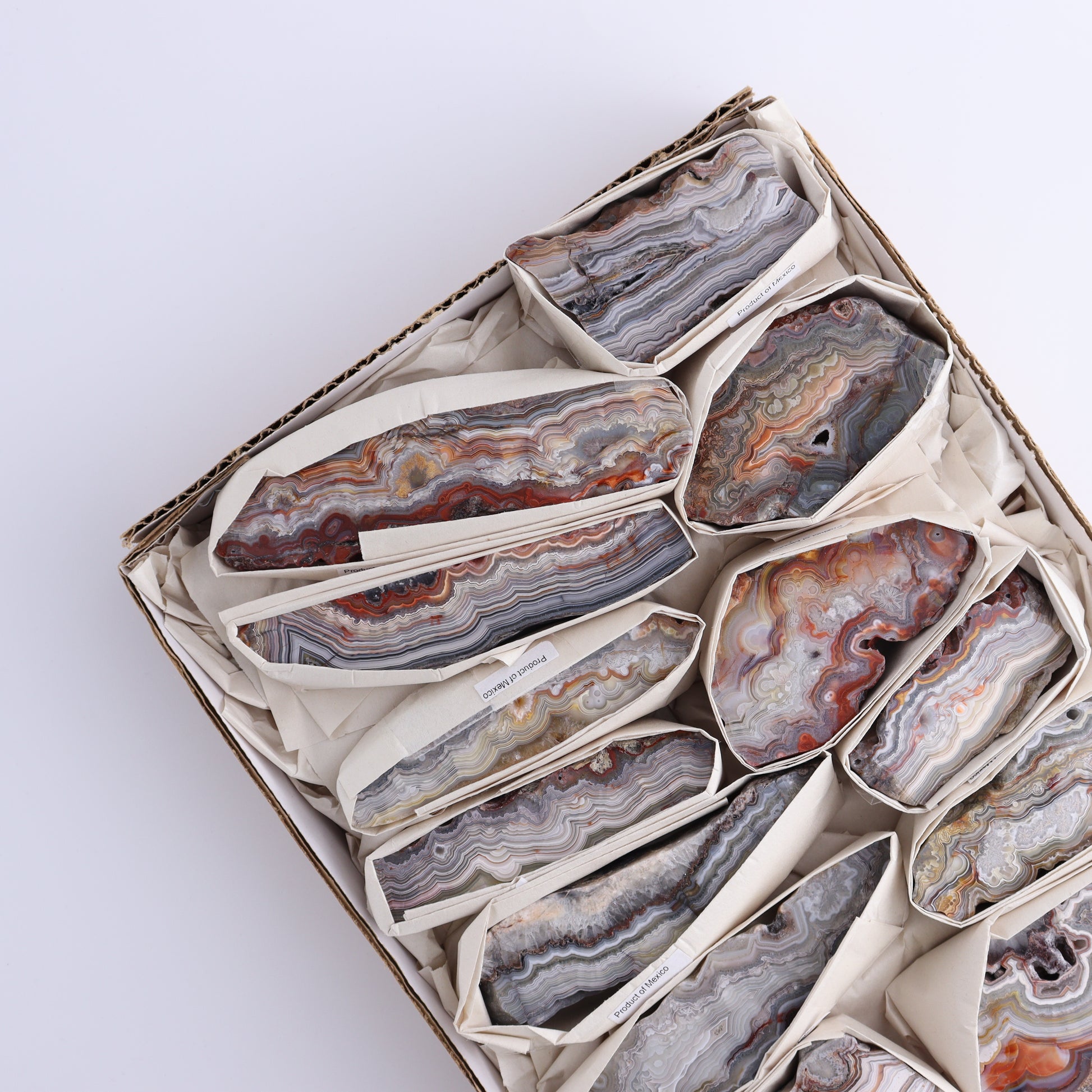 Crazy Lace Agate Flat of 13 - Expert Wholesale and Supplier of Wholesale Crystals & Bulk Gemstones, ["Crazy Lace Agate","Mexico"]