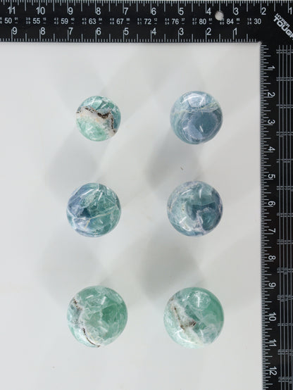 Fluorite Spheres Set of 6 - Expert Wholesale and Supplier of Wholesale Crystals & Bulk Gemstones, []