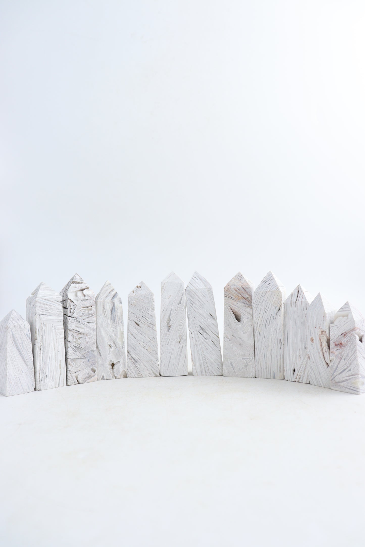 Mexican White Agate Towers Set of 12 - Expert Supplier of Wholesale Crystals & Bulk Gemstones