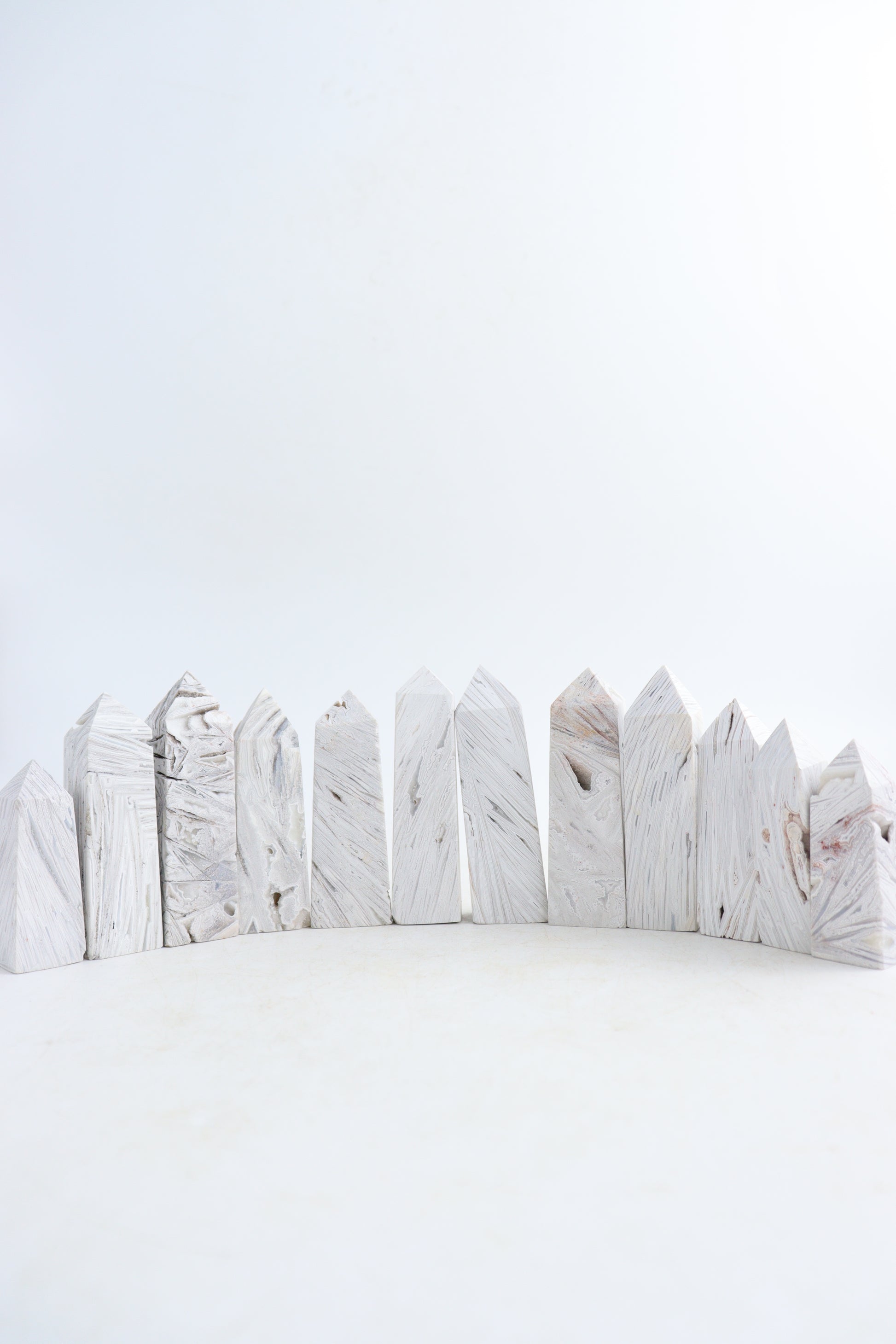 Mexican White Agate Towers Set of 12 - Expert Supplier of Wholesale Crystals & Bulk Gemstones
