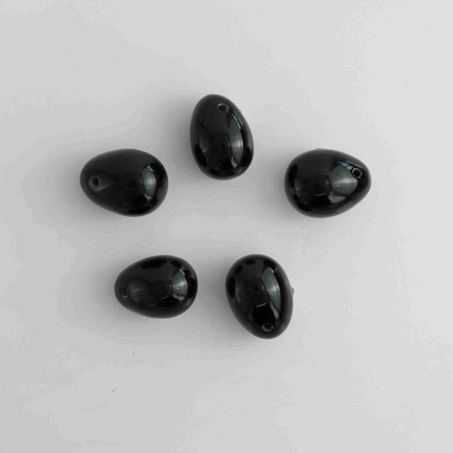 Obsidian Small Eggs with two holes - Expert Vendor of Wholesale Crystals