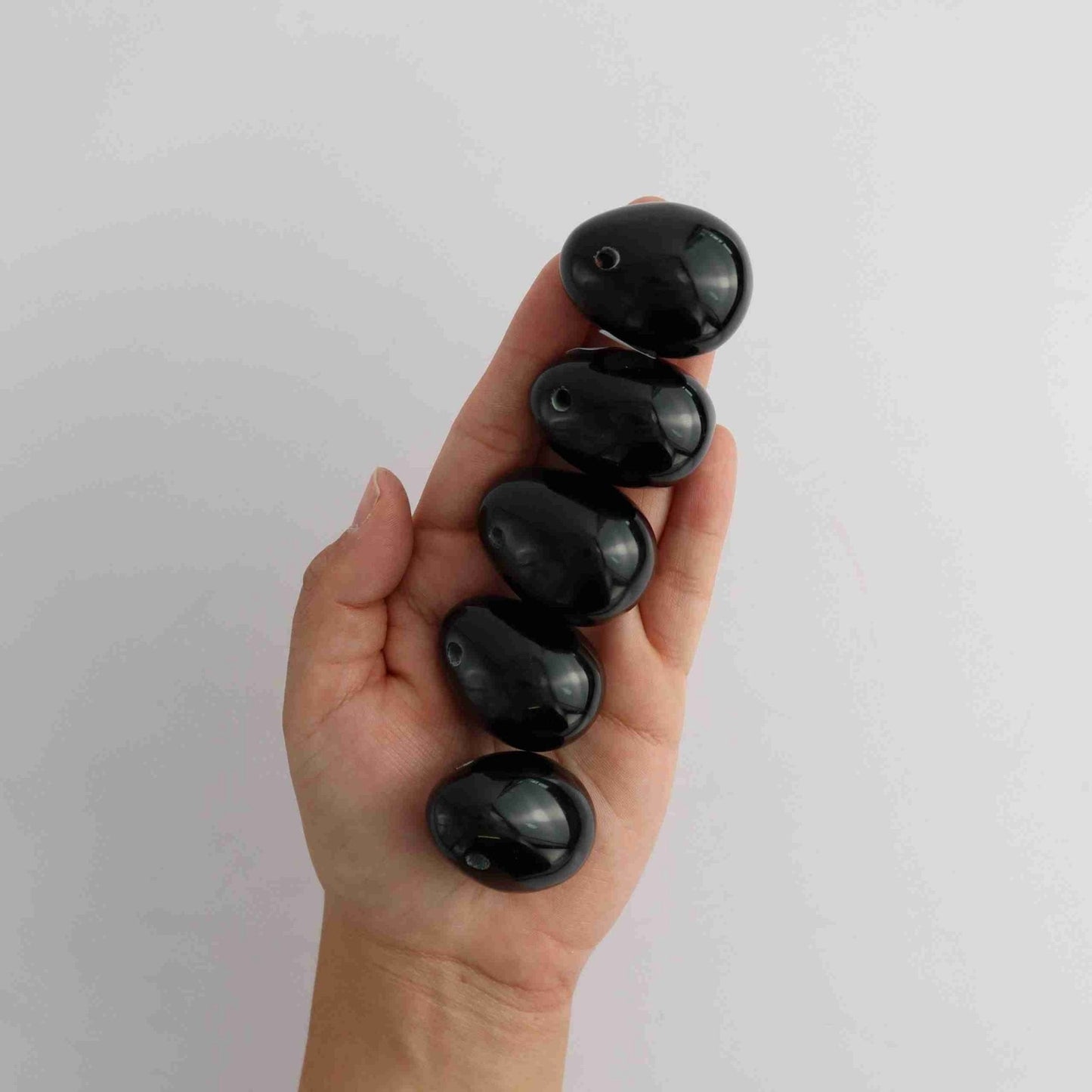 Obsidian Small Eggs with two holes - Expert Vendor of Wholesale Crystals